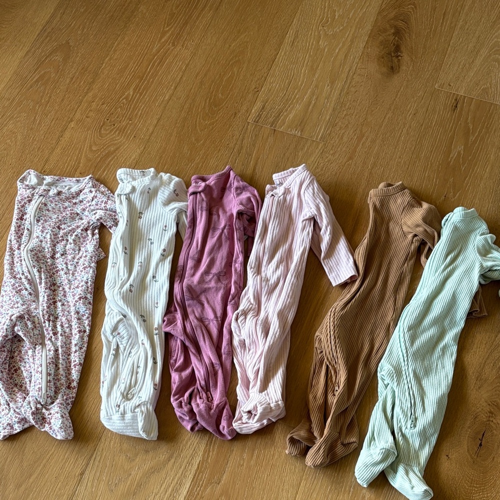Bundle of baby sleeper onesies